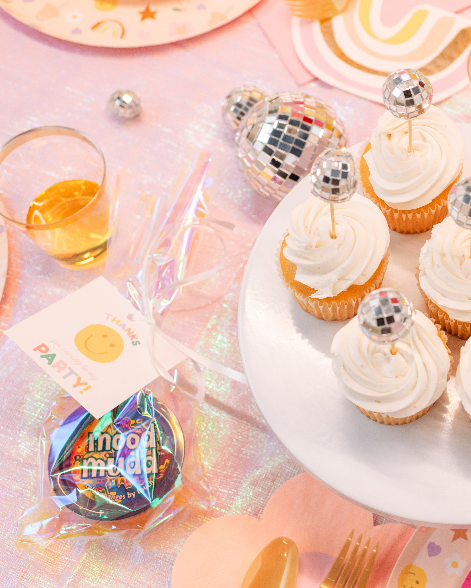 Groovy Party Pack favors including daisy straws, disco ball decor, and tie-dye color changing slime party favor