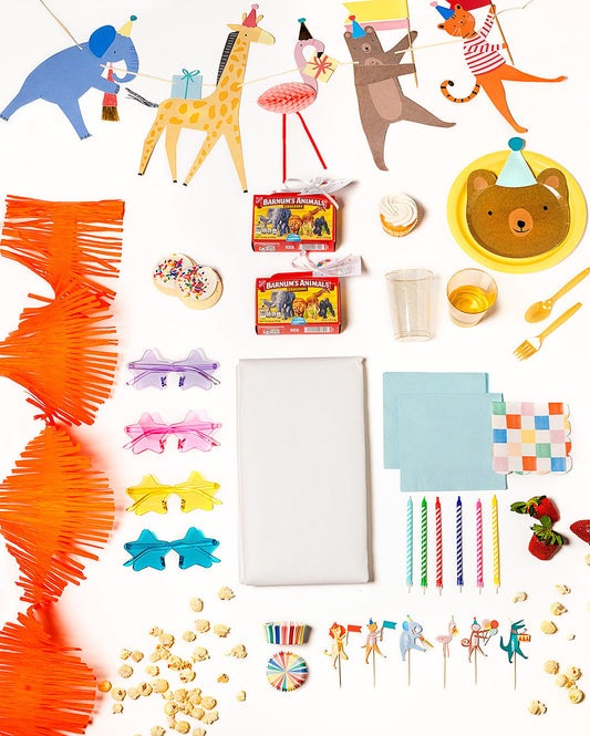 Jungle-themed Party Animal party pack with animal face plates, cups, and colorful decor