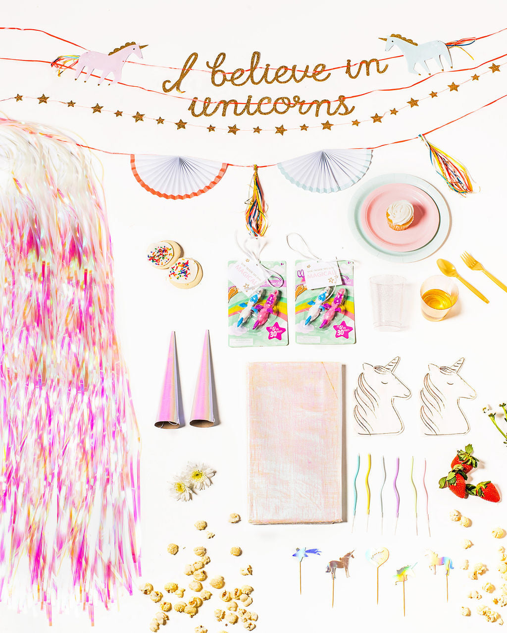 Unicorn-themed birthday party pack with pastel plates, unicorn napkins, and magical decorations