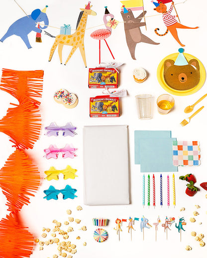 Jungle-themed Party Animal party pack with animal face plates, cups, and colorful decor